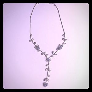 Silver necklace with flowers and petals
